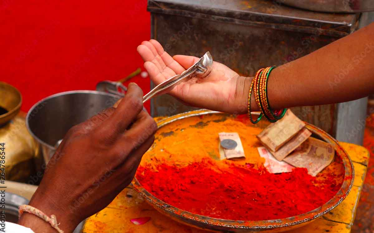 why we take theertham in temple 